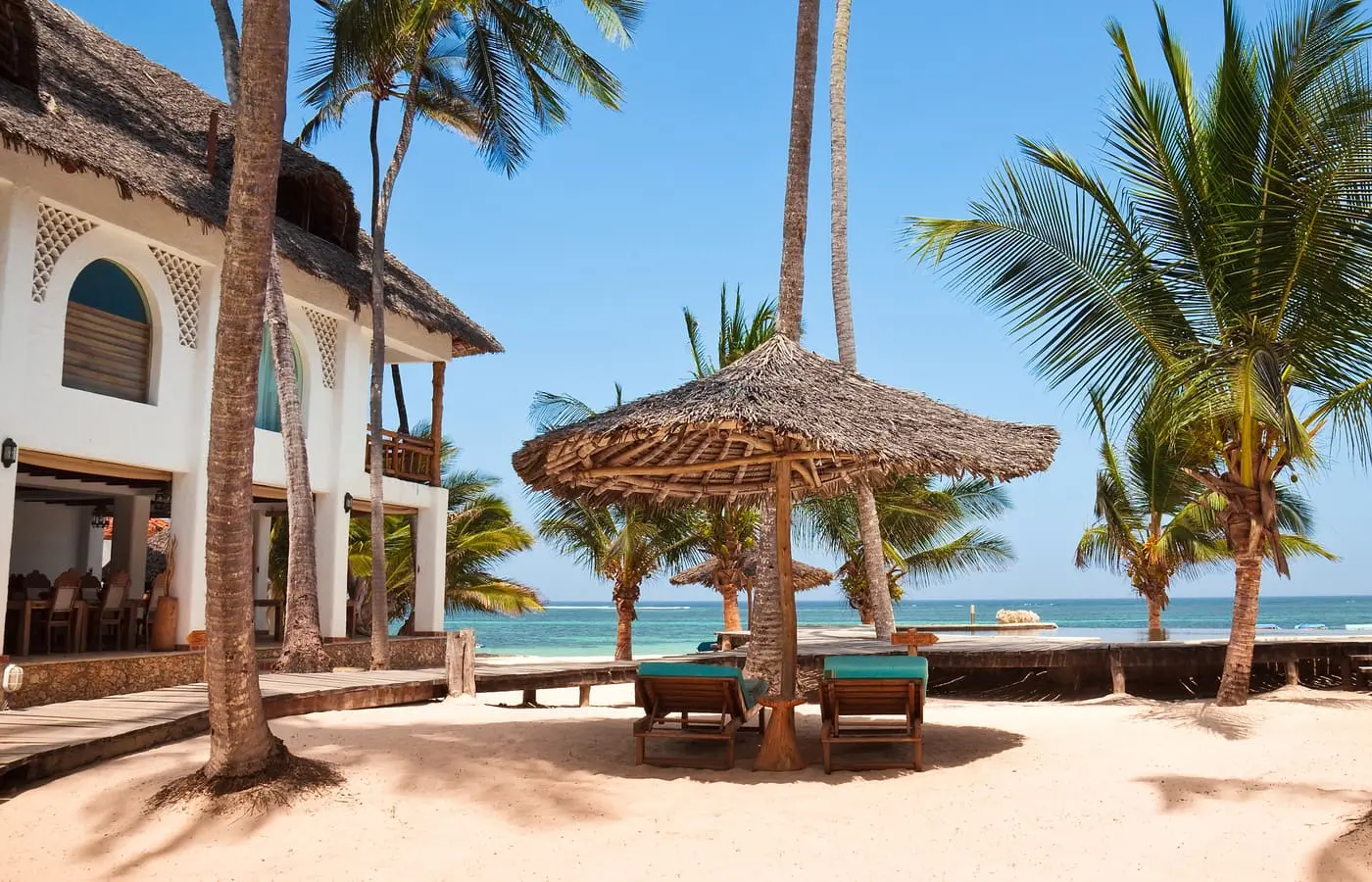 Loungers in the shade overlooking the Indian Ocean at Waterlovers Beach Resort, Diani